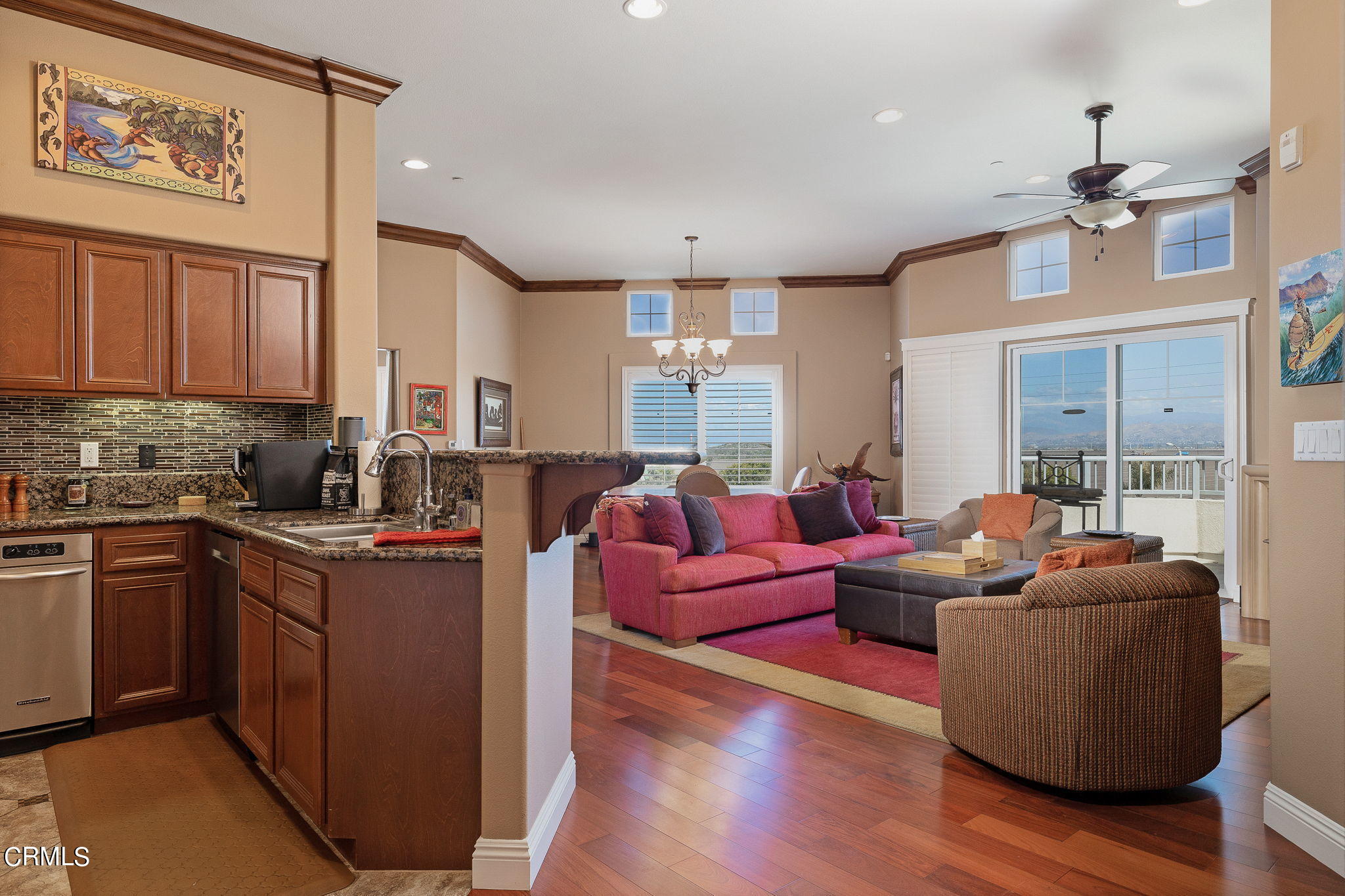 4288 Tradewinds Drive Oxnard, CA 93035 - Photo 8 of 42 a living room with furniture a large window and wooden floors