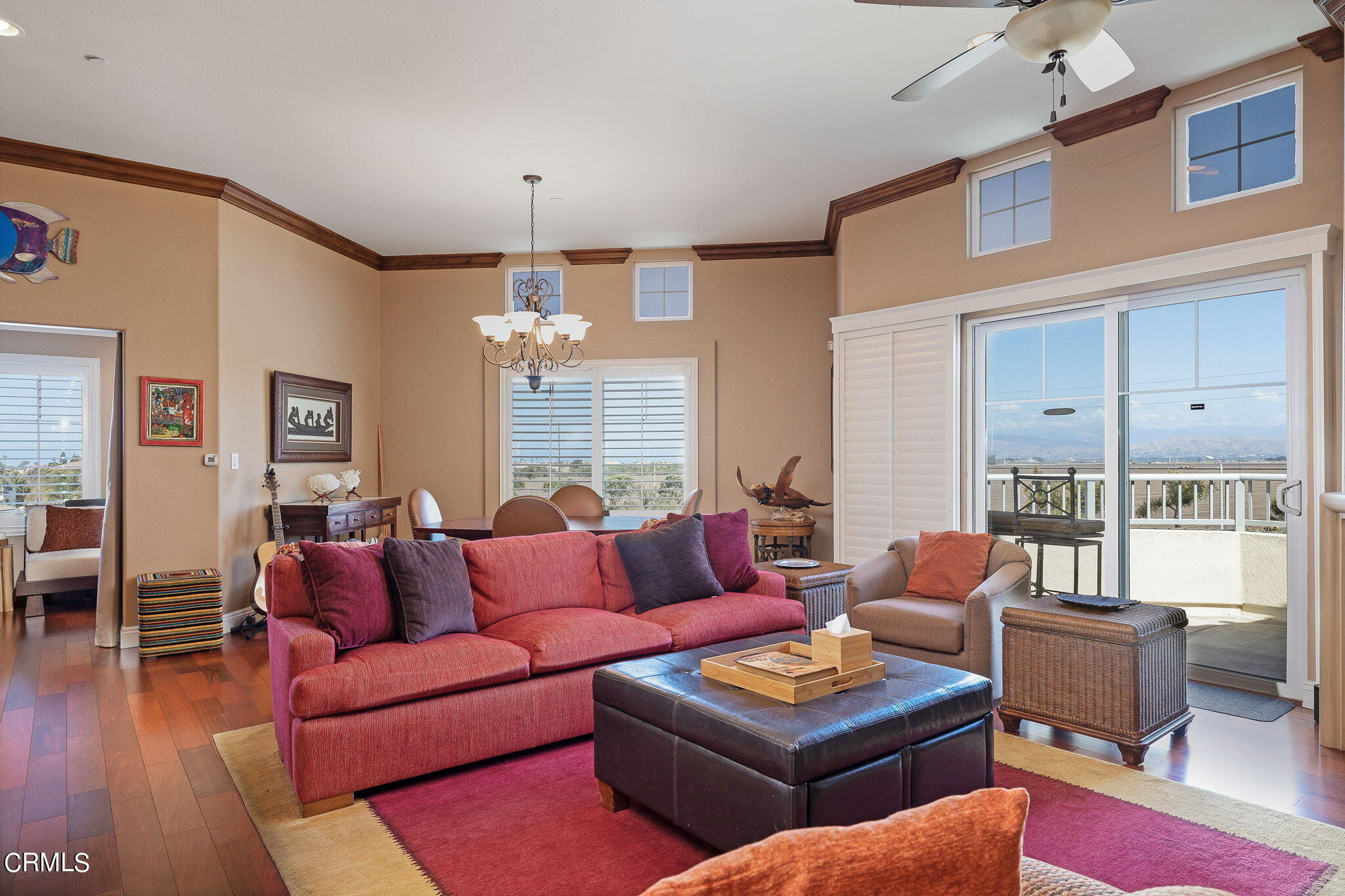 4288 Tradewinds Drive Oxnard, CA 93035 - Photo 9 of 42 a living room with furniture a fireplace and a chandelier
