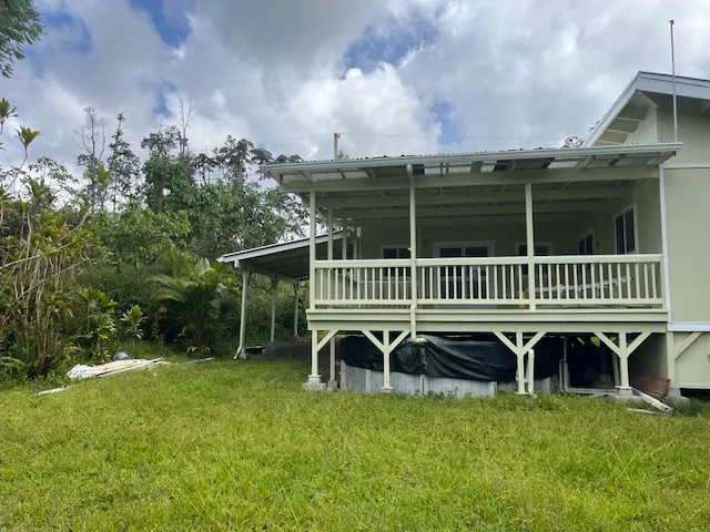 a kitchen with a sink a refrigerator a stove and cabinets