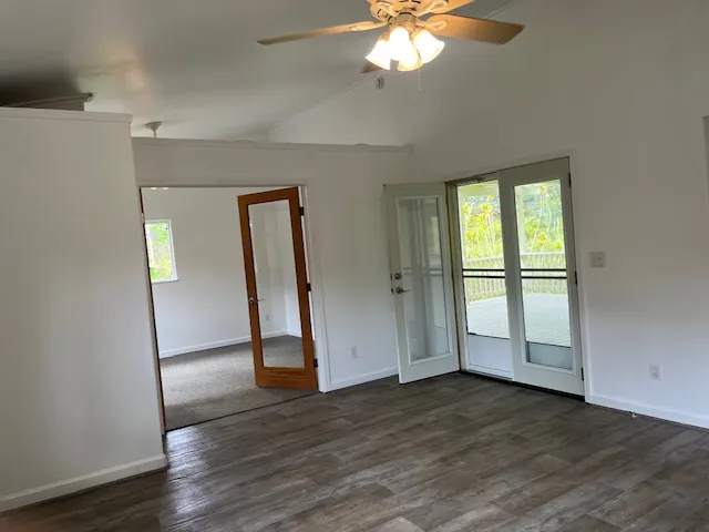 a view of hallway with wooden floor
