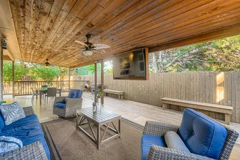 a dining room with furniture and a garden