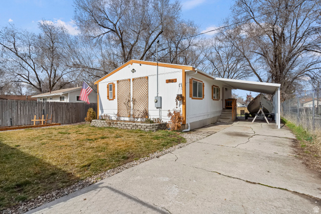 862 West Lake Street Ogden, UT 84401 - Photo 1 of 1 View of front facade with driveway, an attached carport, and entry steps