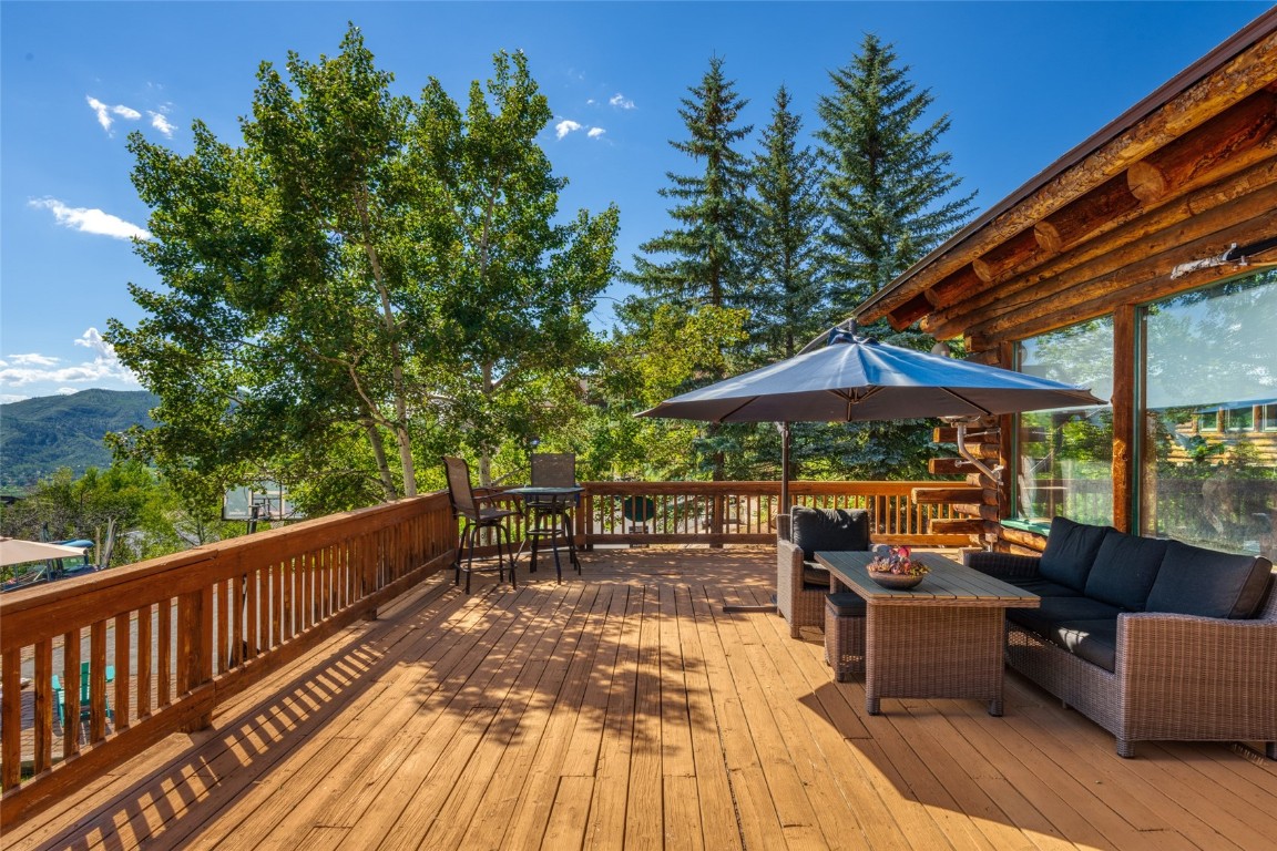 2350 Glacier Ridge Steamboat Springs, CO 80487 - Photo 45 of 47 a view of balcony with chairs and wooden floor
