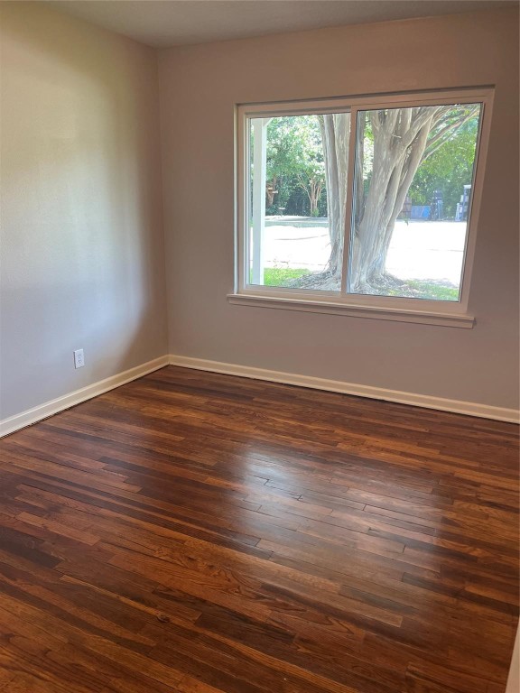 104 Peach Street Tomball, TX 77375 - Photo 12 of 19 a view of a room with wooden floor and window