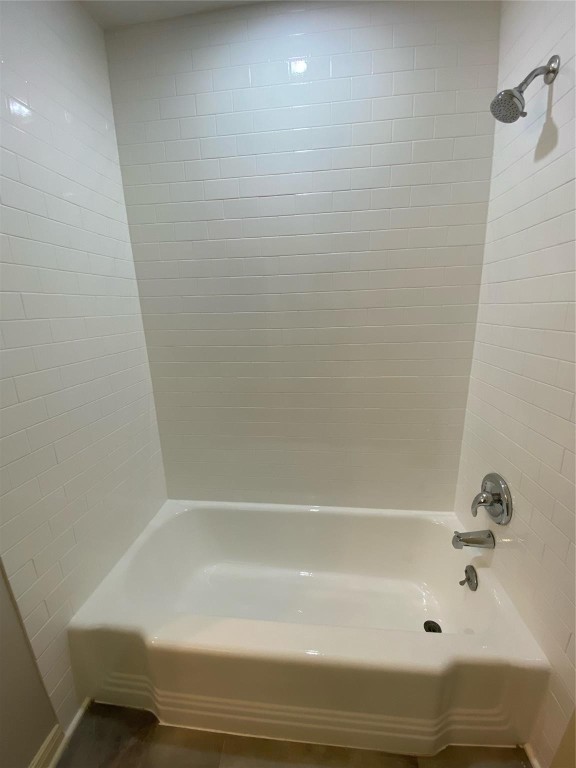 104 Peach Street Tomball, TX 77375 - Photo 15 of 19 a bathroom with a bathtub