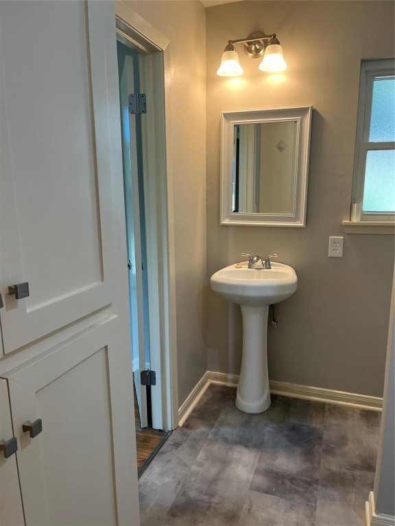 104 Peach Street Tomball, TX 77375 - Photo 16 of 19 a bathroom with a sink a mirror and shower