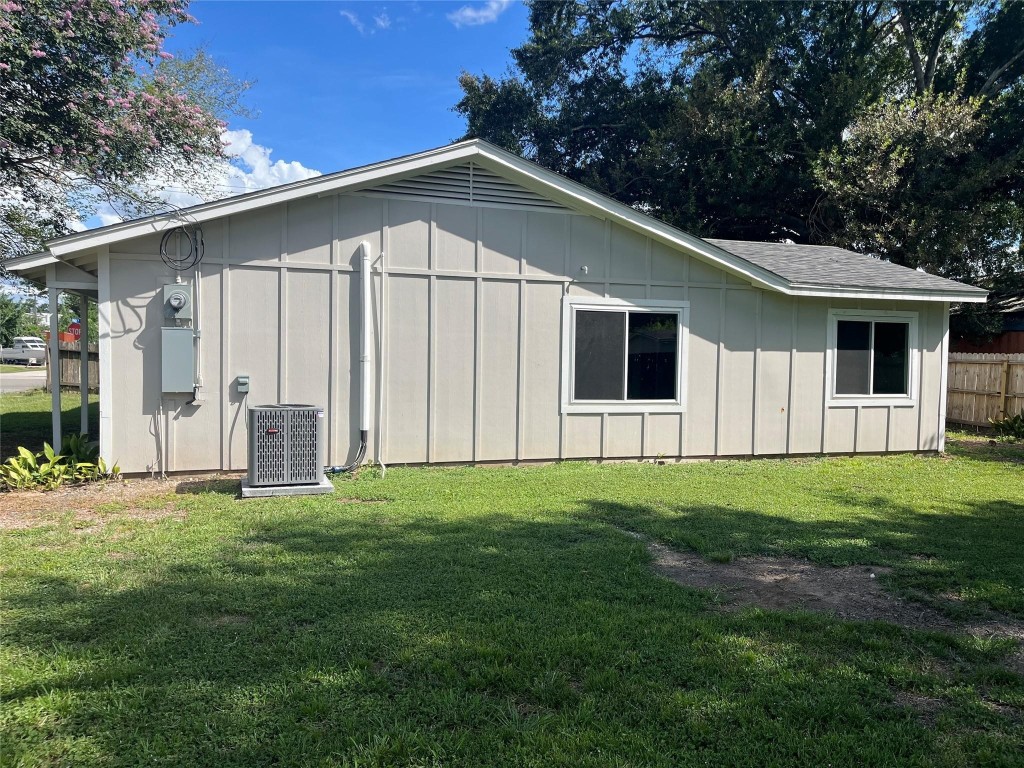104 Peach Street Tomball, TX 77375 - Photo 19 of 19 a big house with a big yard and large trees