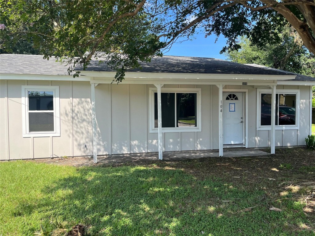 104 Peach Street Tomball, TX 77375 - Photo 2 of 19 a front view of a house with garden