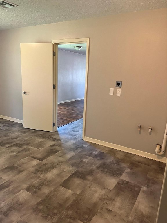 104 Peach Street Tomball, TX 77375 - Photo 9 of 19 an empty room with wooden floor and entrance