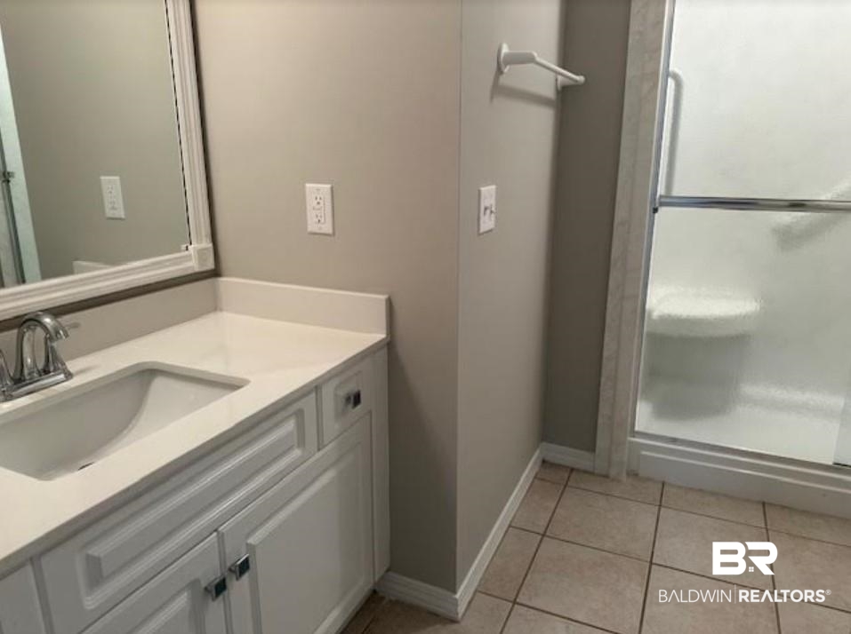 1512 North Cedar Street Foley, AL 36535 - Photo 10 of 13 Bathroom featuring tile patterned floors and vanity