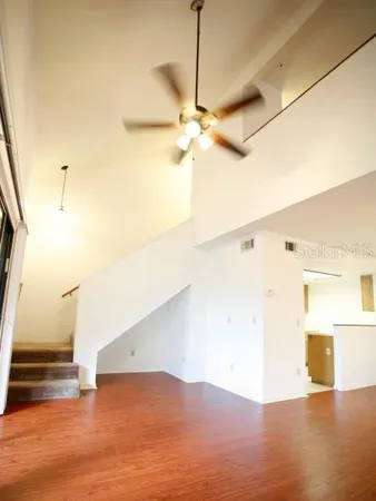 a view of a room with wooden floor