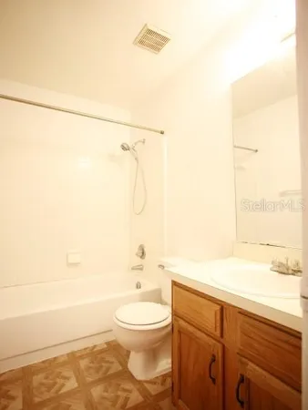 a bathroom with a toilet a sink and a bathtub