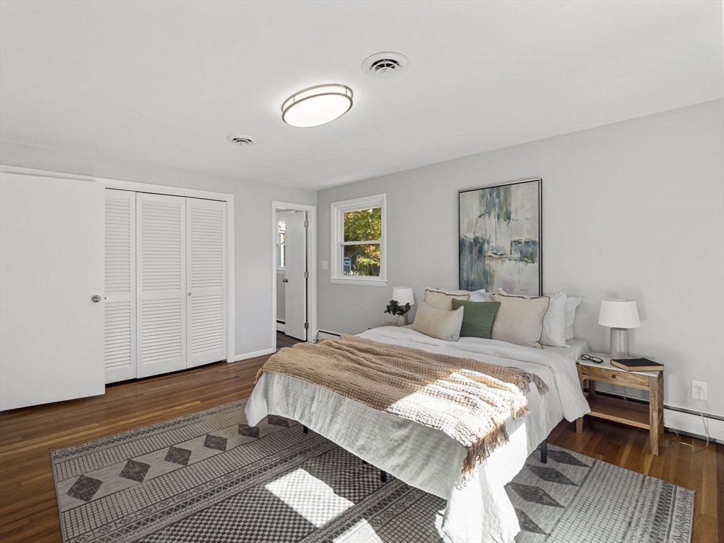 33 Fox Hill Road Framingham, MA 01701 - Photo 13 of 34 a bedroom with a bed and a night stand