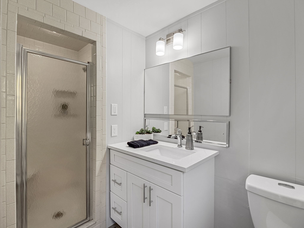 33 Fox Hill Road Framingham, MA 01701 - Photo 15 of 34 a bathroom with a sink toilet and shower
