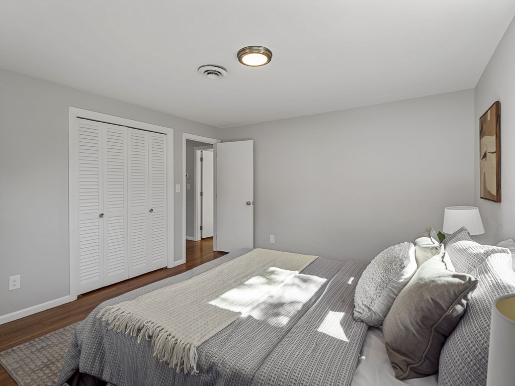 33 Fox Hill Road Framingham, MA 01701 - Photo 17 of 34 a bedroom with a bed and a lamp