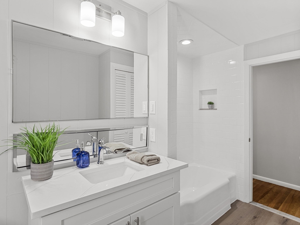 33 Fox Hill Road Framingham, MA 01701 - Photo 18 of 34 a bathroom with a sink a bathtub and a mirror