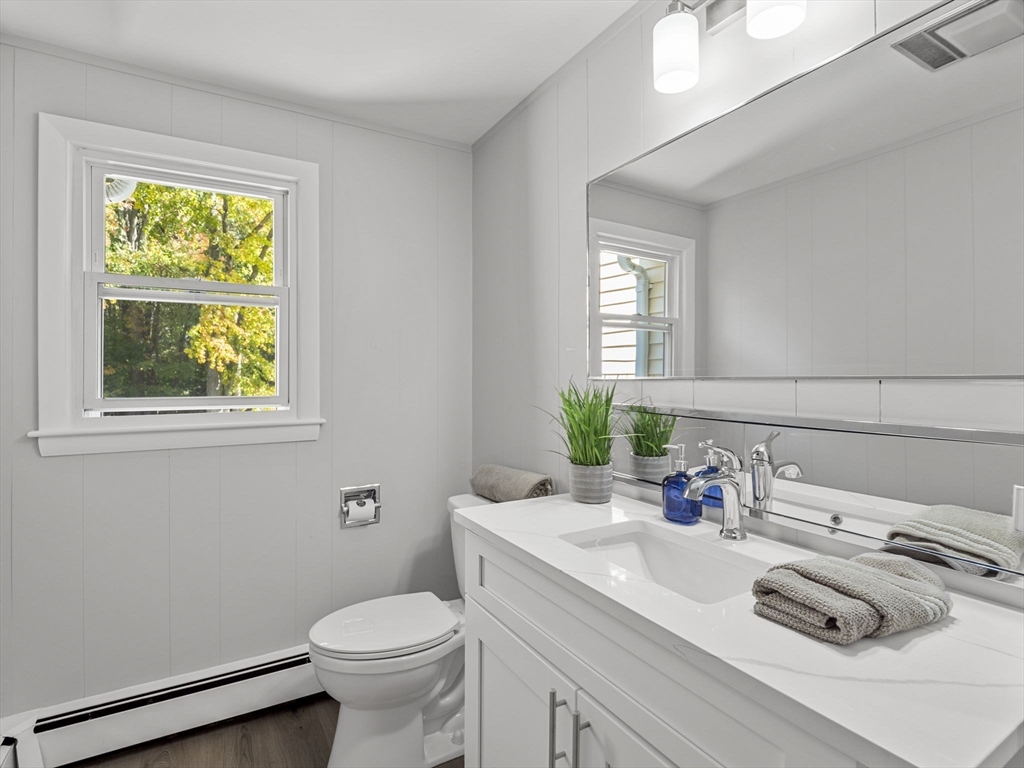 33 Fox Hill Road Framingham, MA 01701 - Photo 19 of 34 a bathroom with a granite countertop toilet sink and mirror