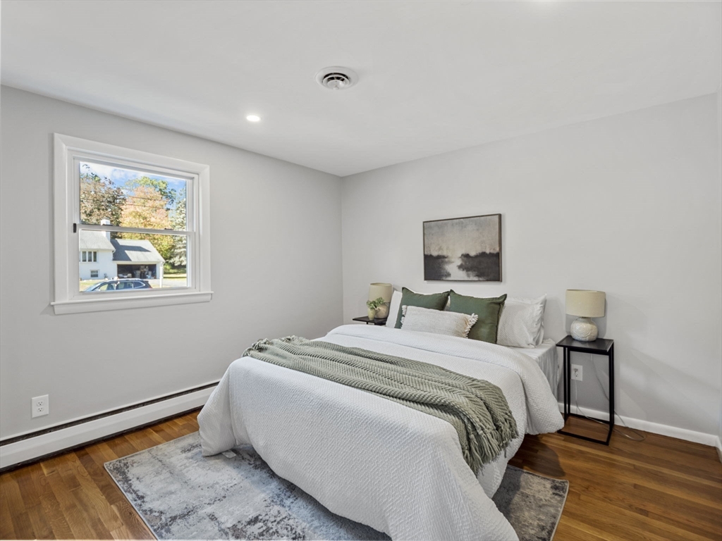 33 Fox Hill Road Framingham, MA 01701 - Photo 21 of 34 a bed room with a bed and a painting on the wall
