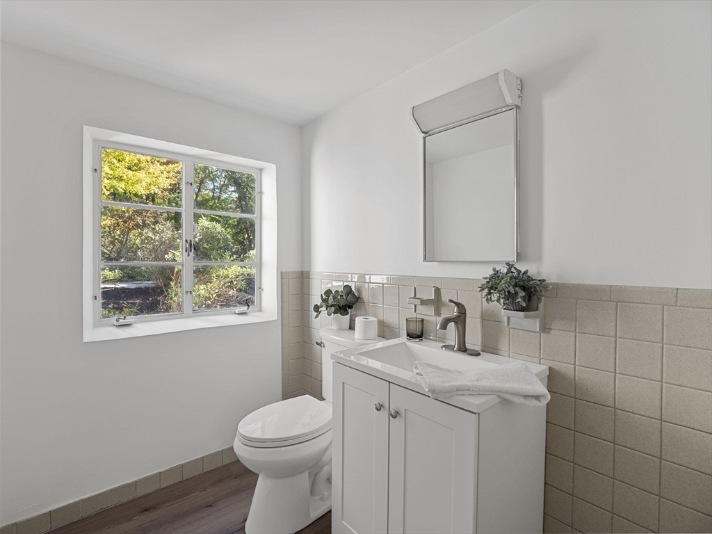 33 Fox Hill Road Framingham, MA 01701 - Photo 22 of 34 a bathroom with a toilet sink vanity and mirror