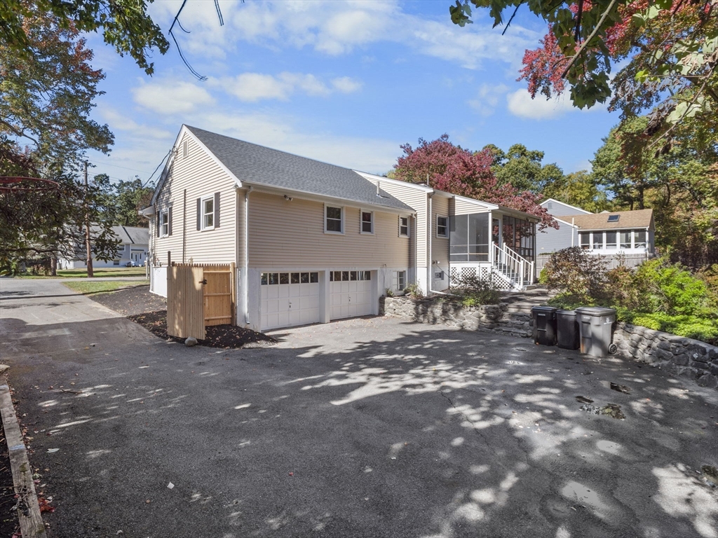 33 Fox Hill Road Framingham, MA 01701 - Photo 25 of 34 a view of a house with backyard and a tree