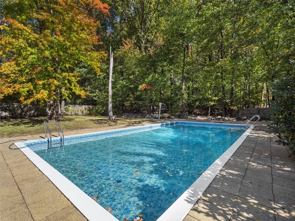 33 Fox Hill Road Framingham, MA 01701 - Photo 29 of 34 a view of a swimming pool with a yard