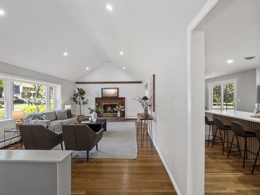 33 Fox Hill Road Framingham, MA 01701 - Photo 3 of 34 a living room with fireplace furniture and a wooden floor