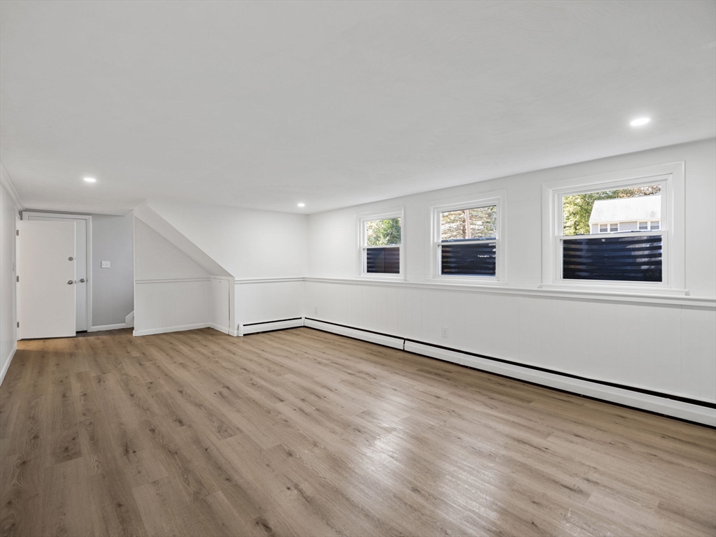 33 Fox Hill Road Framingham, MA 01701 - Photo 32 of 34 an empty room with wooden floor and windows