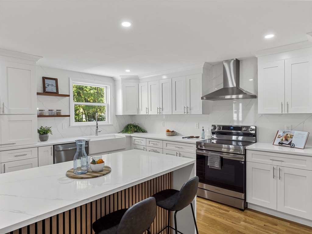 33 Fox Hill Road Framingham, MA 01701 - Photo 5 of 34 a kitchen with a stove a sink and a refrigerator