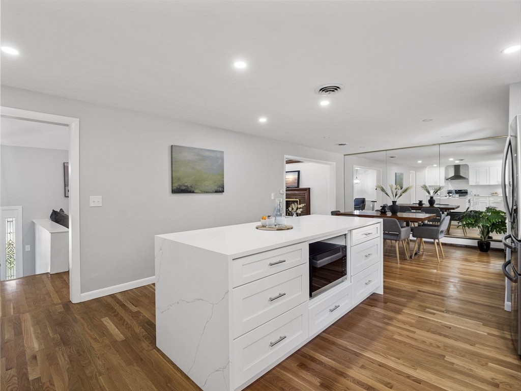 33 Fox Hill Road Framingham, MA 01701 - Photo 7 of 34 a hall with cabinets and wooden floor