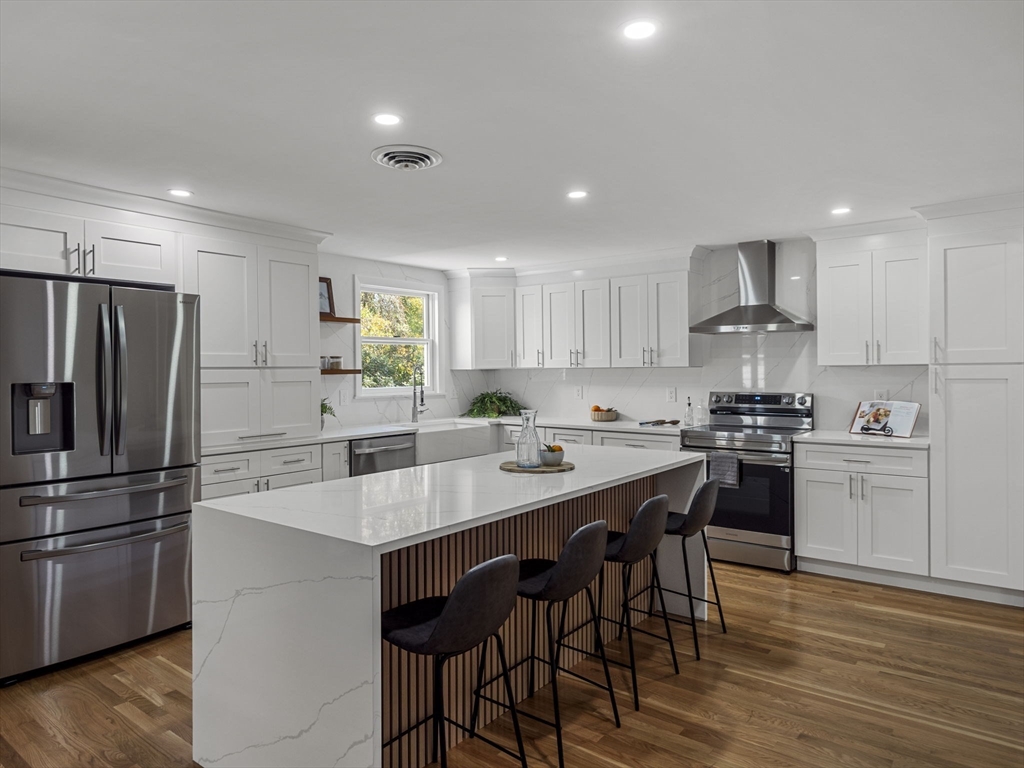 33 Fox Hill Road Framingham, MA 01701 - Photo 8 of 34 a kitchen with a sink stainless steel appliances and white cabinets