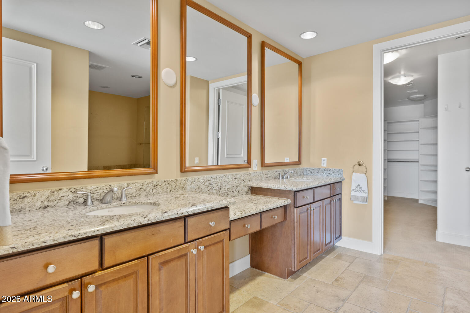 2211 East Camelback Road, Unit 604 Phoenix, AZ 85016 - Photo 10 of 17 a bathroom with a granite countertop sink and a mirror