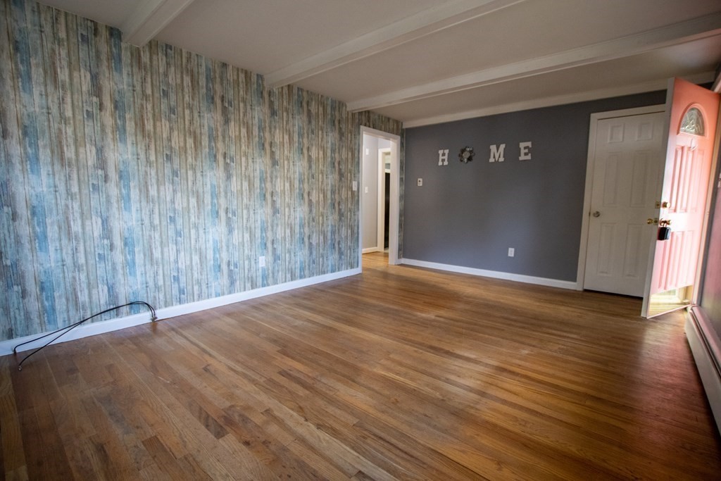 146 Davis Street Springfield, MA 01104 - Photo 2 of 15 a view of an empty room with wooden floor