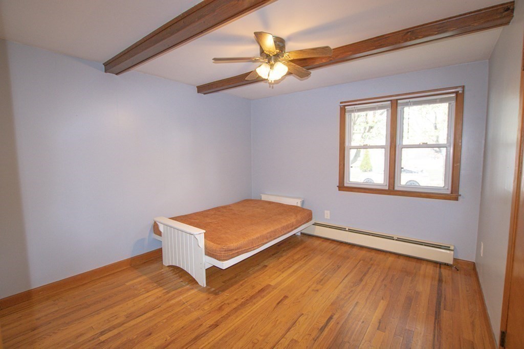 146 Davis Street Springfield, MA 01104 - Photo 10 of 15 a room with wooden floor and window