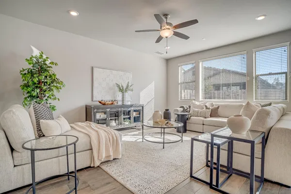 a living room with furniture and a large window