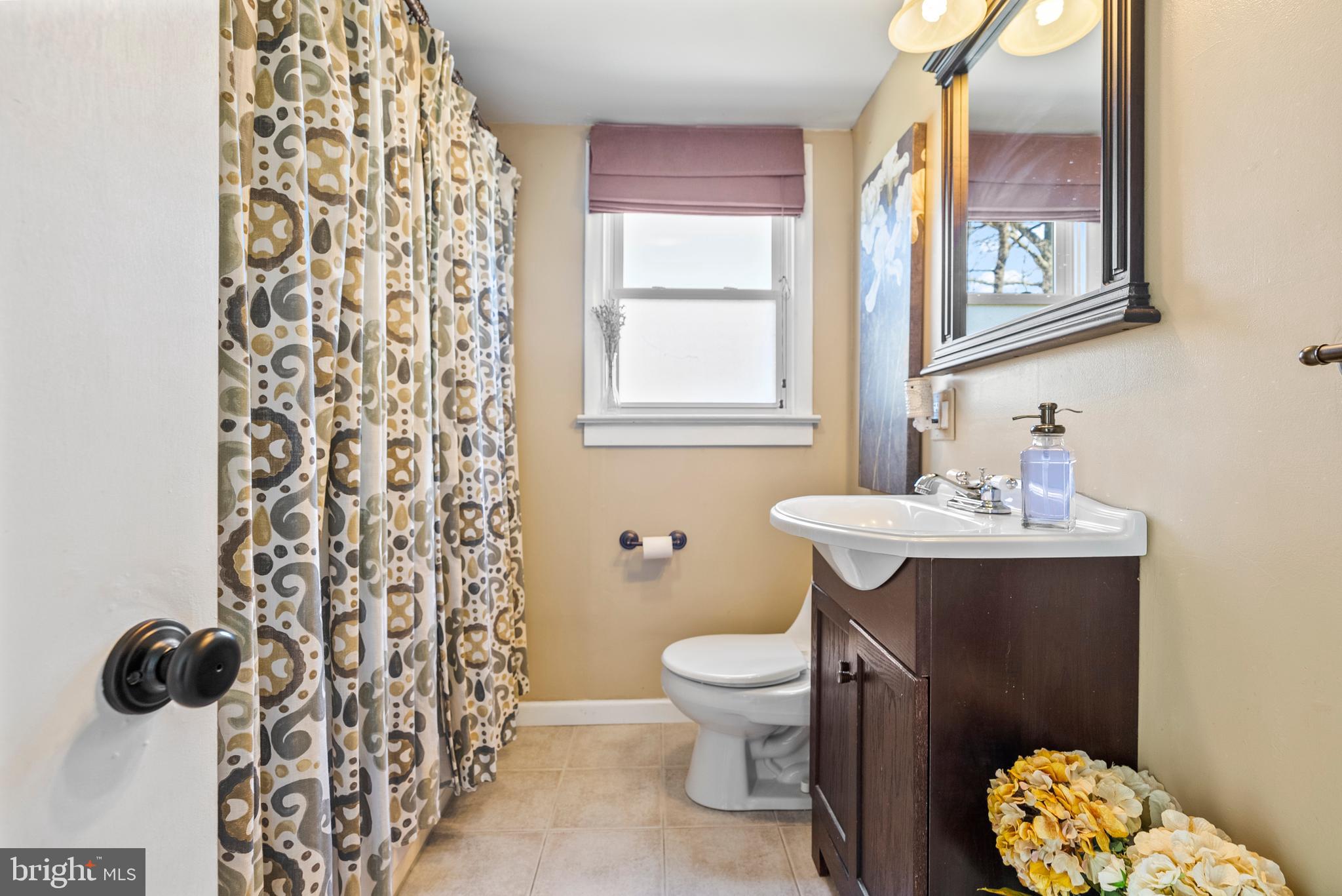 41 Pine Street Beverly, NJ 08010 - Photo 18 of 31 a bathroom with a toilet sink and mirror