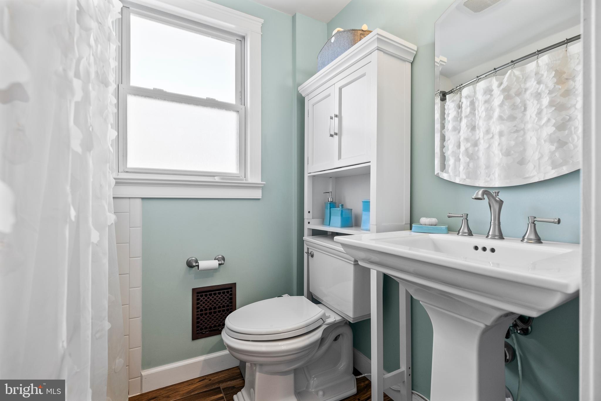 41 Pine Street Beverly, NJ 08010 - Photo 22 of 31 a bathroom with a sink toilet and a mirror