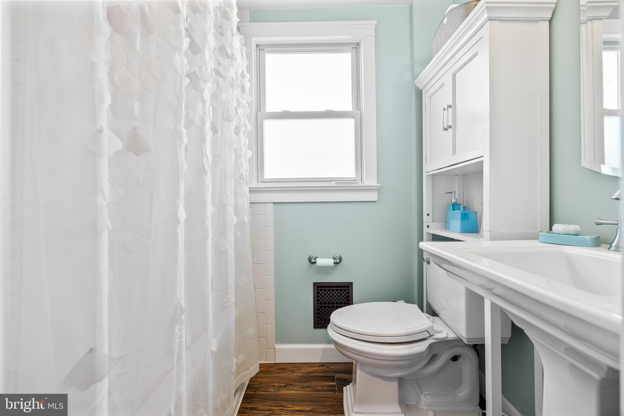 41 Pine Street Beverly, NJ 08010 - Photo 23 of 31 a bathroom with a sink a toilet and a mirror