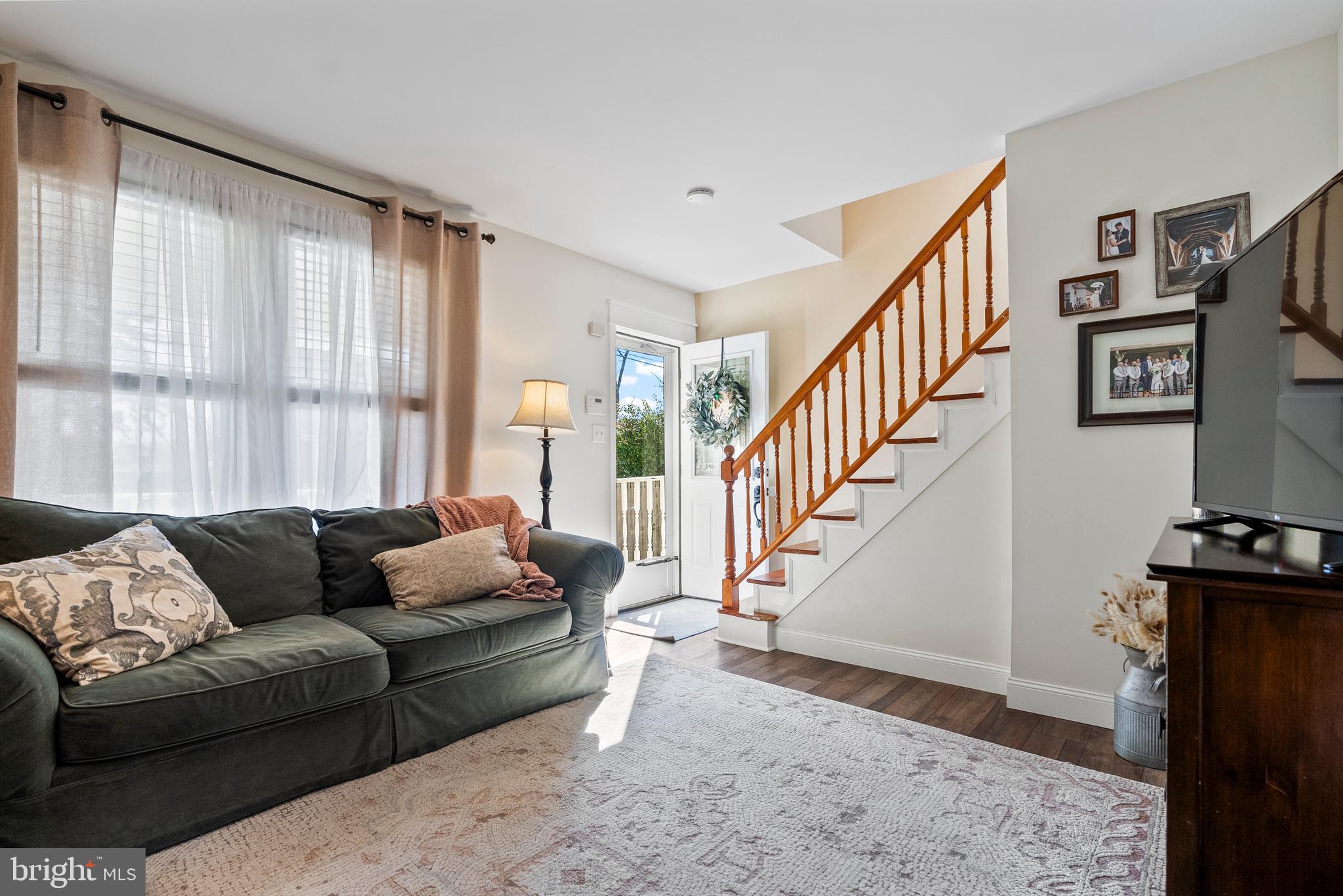 41 Pine Street Beverly, NJ 08010 - Photo 6 of 31 a living room with furniture and a flat screen tv with wooden floor