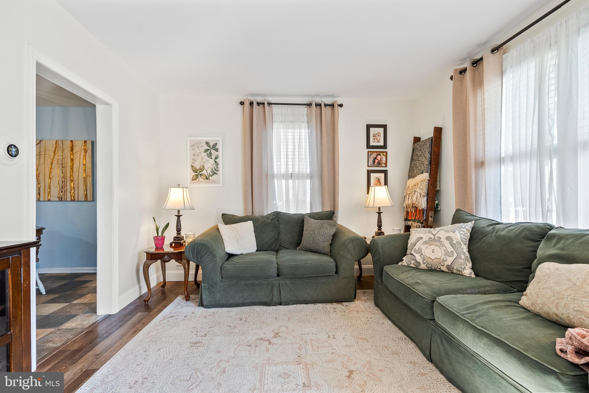 41 Pine Street Beverly, NJ 08010 - Photo 7 of 31 a living room with furniture and a large window