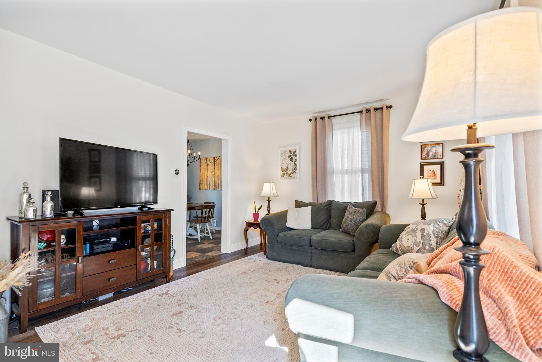 41 Pine Street Beverly, NJ 08010 - Photo 8 of 31 a living room with furniture and a flat screen tv