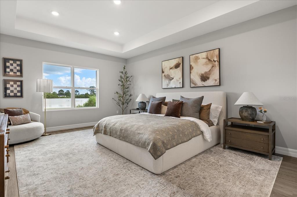 25 Freesia Court Homosassa, FL 34446 - Photo 17 of 30 a spacious bedroom with a bed and glass window