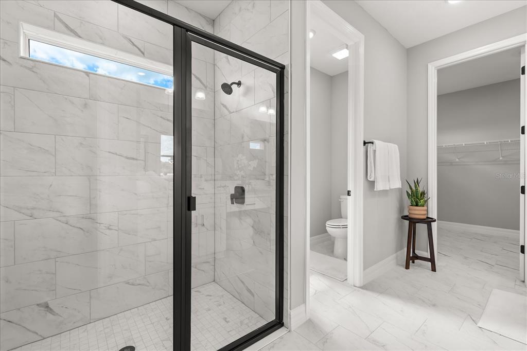 25 Freesia Court Homosassa, FL 34446 - Photo 21 of 30 a bathroom with a glass shower door