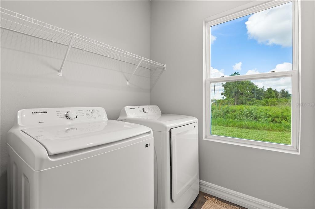 25 Freesia Court Homosassa, FL 34446 - Photo 22 of 30 a utility room with dryer and washer