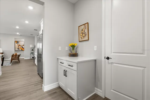 a view of kitchen with furniture and wooden floor
