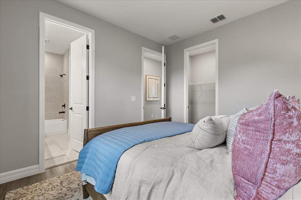 25 Freesia Court Homosassa, FL 34446 - Photo 25 of 30 a bedroom with a bed and a dresser