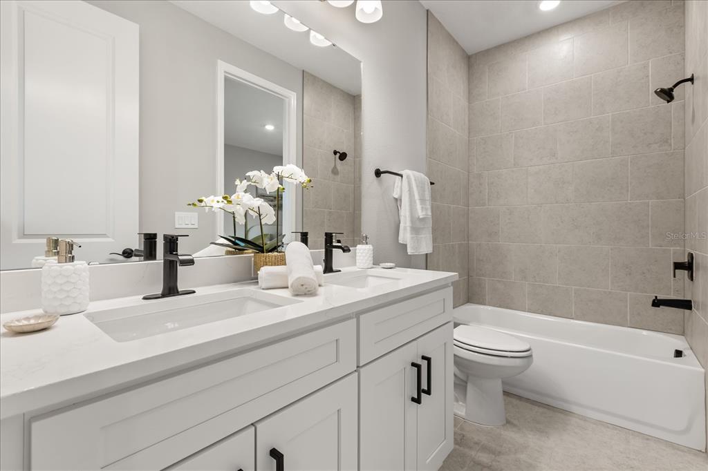 25 Freesia Court Homosassa, FL 34446 - Photo 26 of 30 a bathroom with a sink a toilet and shower