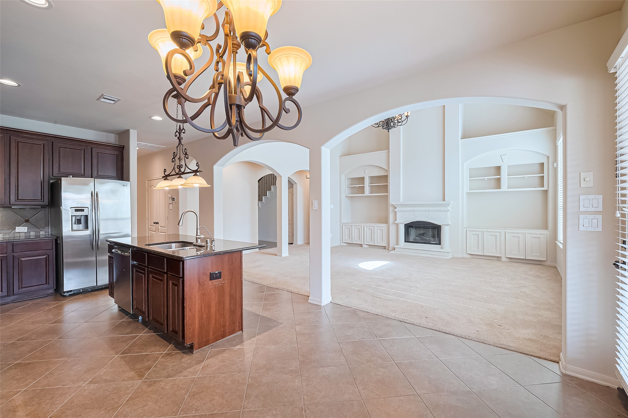 19 Sandwell Place Spring, TX 77389 - Photo 12 of 50 Open kitchen overlooking living spaces.