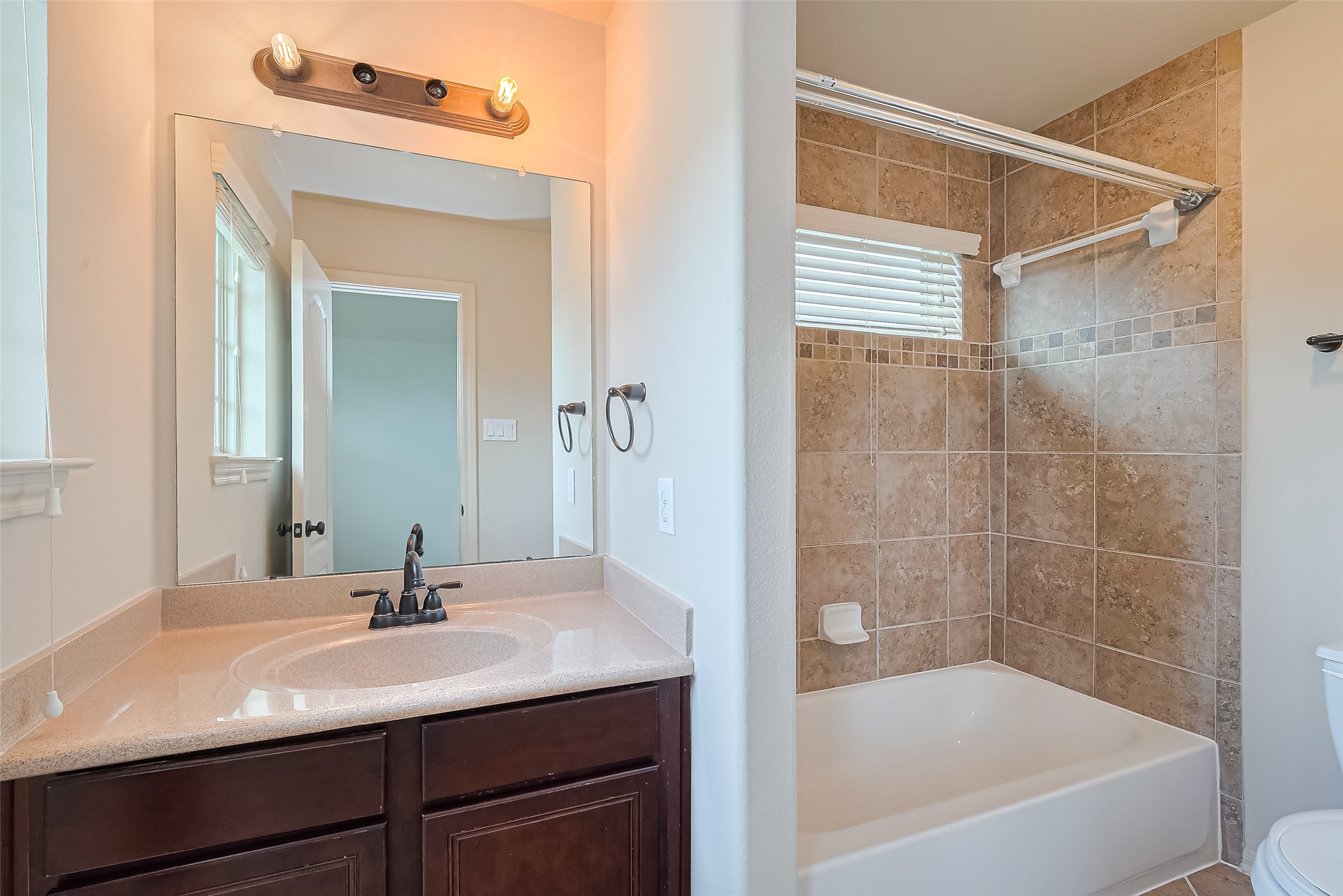 19 Sandwell Place Spring, TX 77389 - Photo 33 of 50 Bedroom 2 features a private en-suite bath.