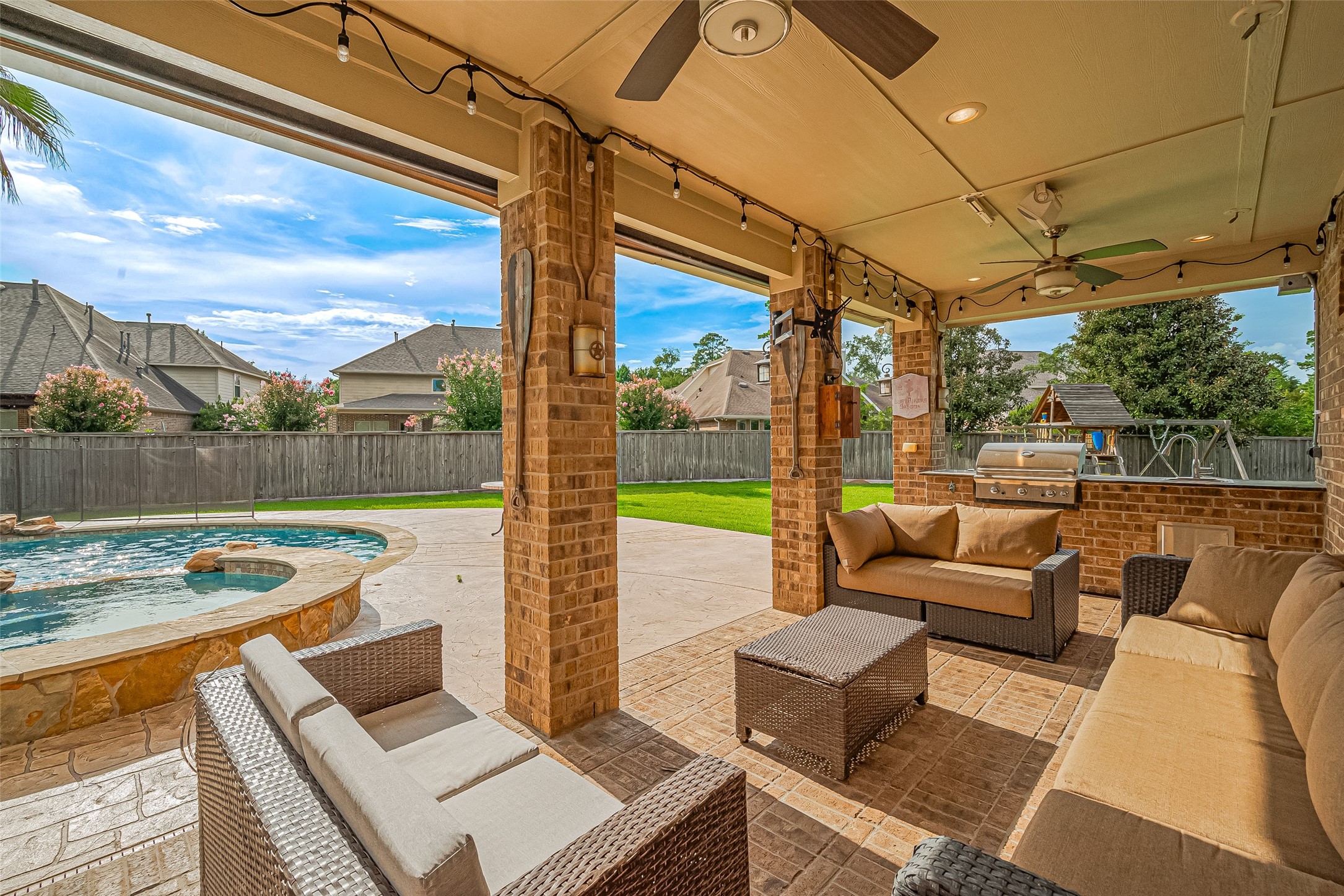 19 Sandwell Place Spring, TX 77389 - Photo 49 of 50 Entertainer’s dream, covered patio with summer kitchen for outdoor gatherings.