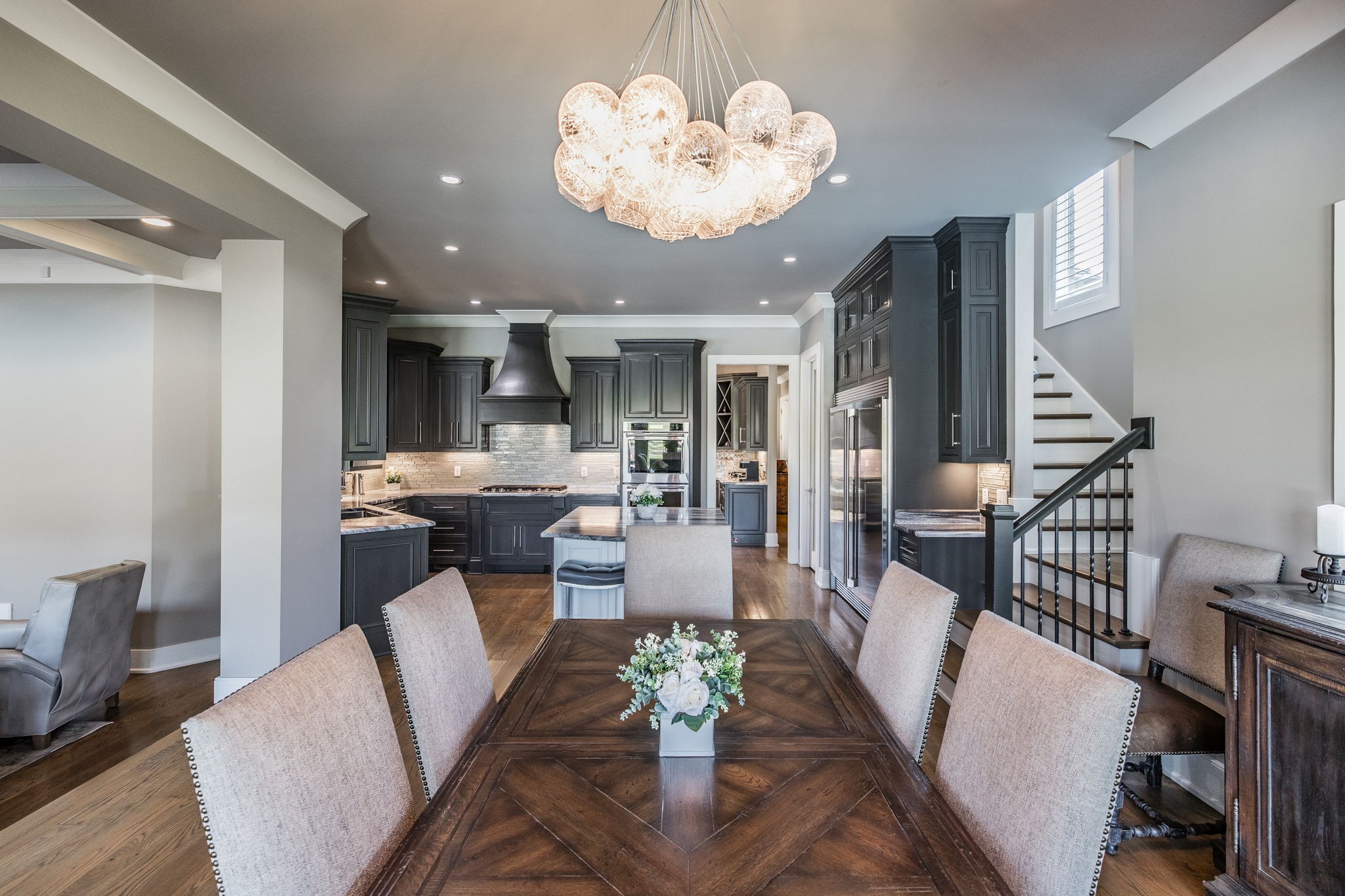 1032 Kendras Run Gallatin, TN 37066 - Photo 13 of 48 a view of a dining room with furniture a chandelier and wooden floor